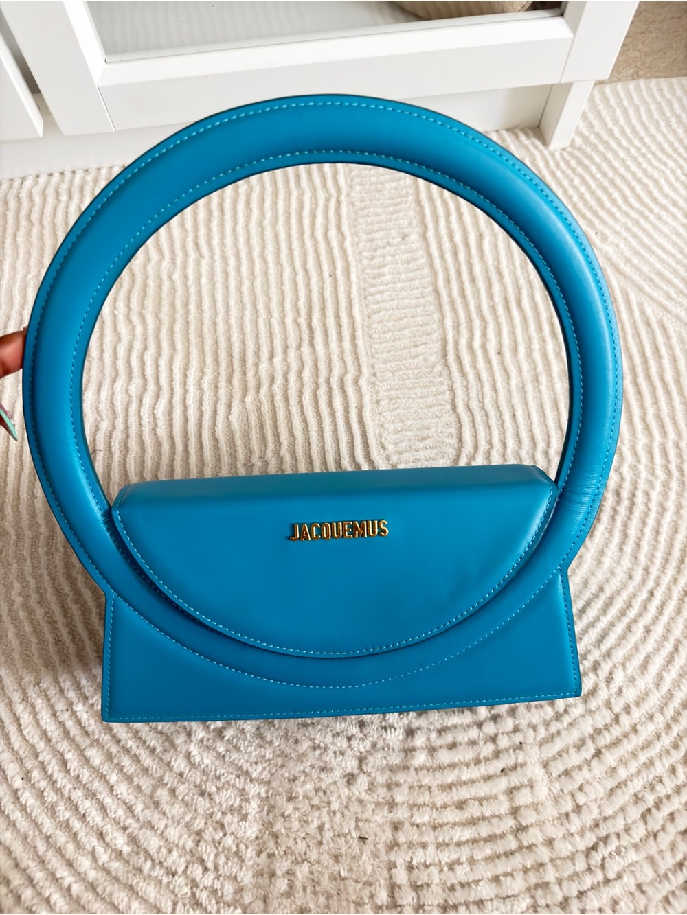 Jacquemus turquoise circular-handle mini bag with gold logo